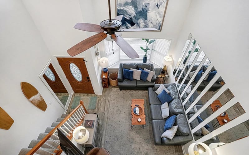 The two-story great room from above — plenty of seating for movie night