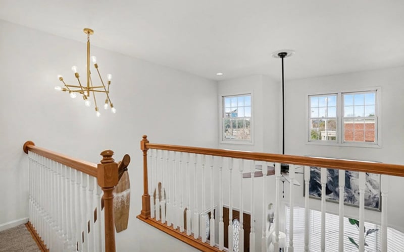Sunny overlook landing leads to the upstairs bedrooms