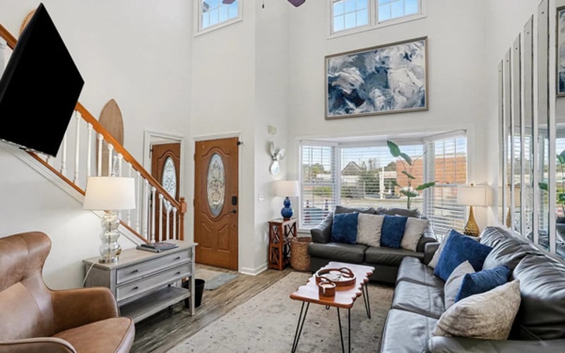Sunlit living room with plush seating and coastal decor — your North Myrtle Beach home base